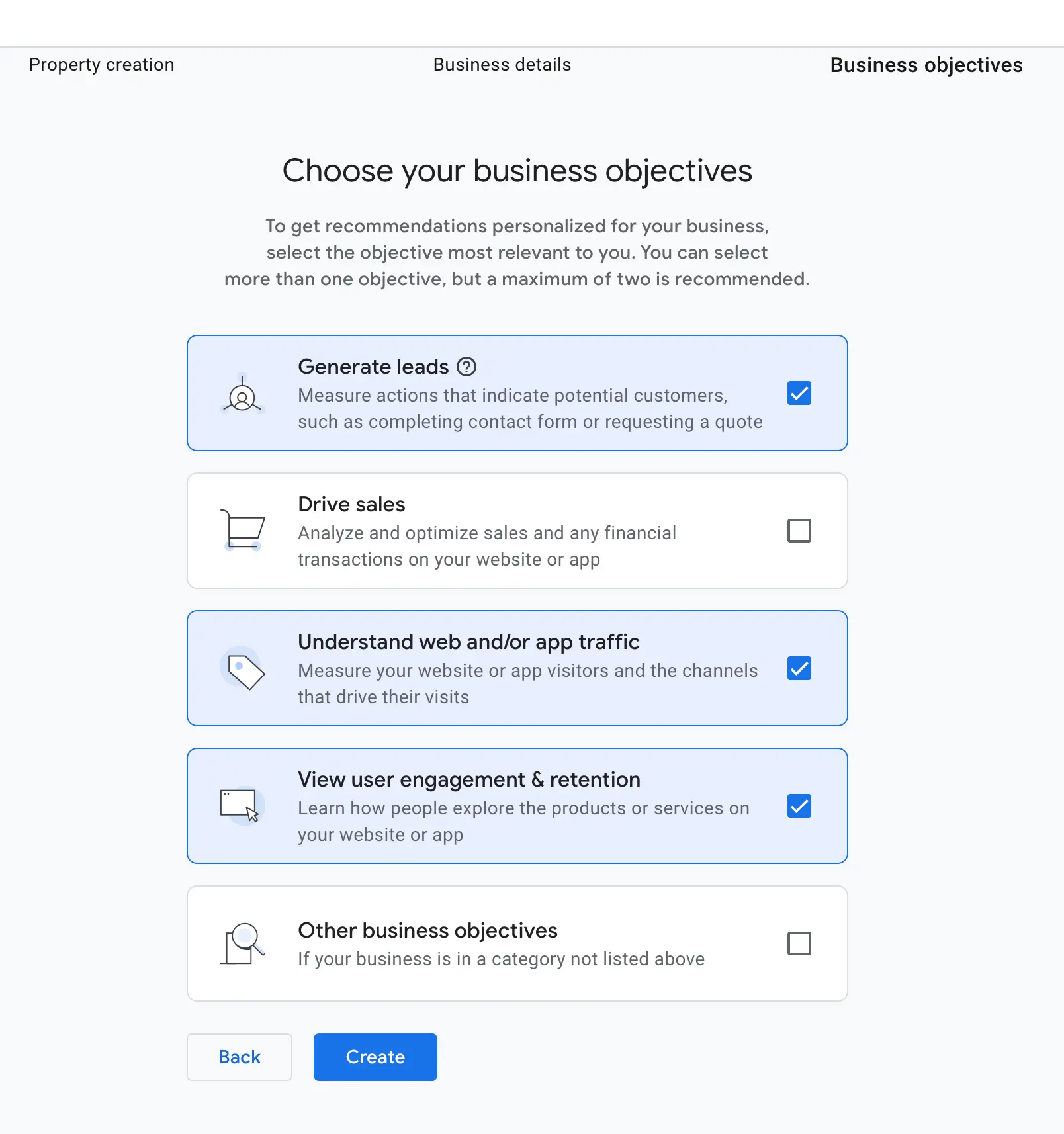 Google Analytics business objectives screen with multiple selectable goals like leads and engagement